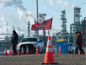 Unifor pickets walk the line at Gate 7 in front of the Co-op Refinery Complex on Fleet Street in Regina on Feb. 18, 2020.