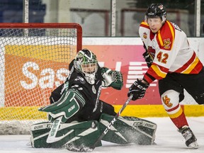 University of Saskatchewan Huskies goalie Taran Kozun stop a shot from University of Calgary Dinos forward Dane Gibson during game 2 action of the Canada West Men's Hockey semifinal at Merlis Belsher Place on the U of S campus in Saskatoon, SK on Saturday, February 22, 2020.