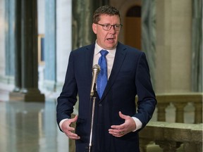 Saskatchewan Premier Scott Moe speaks to reporters at the Saskatchewan Legislative Building in Regina, Saskatchewan on Mar. 17, 2020. The normal scrum procedure was altered to conform with social distancing practices as the province grapples with the COVID-19.