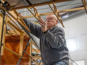 Tom Coates works on an airplane in his hangar. Coates is a retired airplane mechanic who restores historic planes, including several he has donated to the Saskatchewan Aviation Museum.