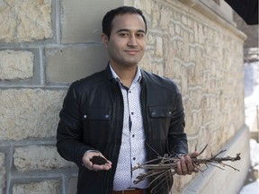 Research associate Sonil Nanda holds biochar and the forestry waste that can produce it.
