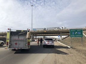 Saskatoon firefighters attend to the scene after a semi truck reportedly hit the overpass at Highway 11 and Circle Drive East on April 20, 2020.