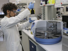 The Global Institute for Food Security (GIFS) Lab Manager Marco Pellino working on the the KingFisher™ Flex, an instrument the lab is providing to the Saskatchewan Health Authority (SHA) that will allow for additional diagnostic testing for COVID-19.