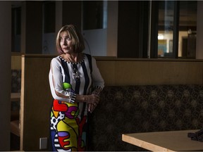 Airline Hotels Ltd. President Betty Anne Latrace-Henderson stands in the empty restaurant at the Travelodge, one of nine hotels the family business owns and operates.