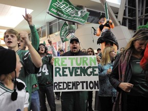 A large crowd of fans greeted the Saskatchewan Roughriders at the Regina International Airport in November 2010. Big Rider crowds may not be seen in Saskatchewan this year as bans on gatherings continue.