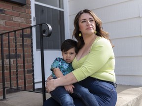 Hairstylist Kelly Knowles poses with her son Hndrxx Hamilton at her home in Regina on Wed Apr. 29, 2020. Kelly Knowles has many questions about returning to work, including where her son would go.