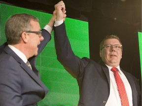 Brad Wall, left, and Scott Moe celebrate Moe's victory in the Saskatchewan Party's leadership race on Jan. 27, 2018.