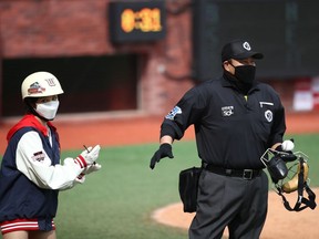 Home plate umpire wears a mask during the Korean Baseball Organization (KBO) League opening game between SK Wyverns and Hanwha Eagles at the empty SK Happy Dream Ballpark on May 05, 2020 in Incheon, South Korea.