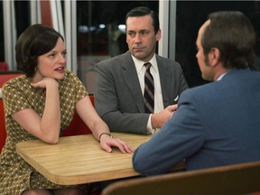 Left to right: Elisabeth Moss (as Peggy Olson), Jon Hamm (Don Draper) and Vincent Kartheiser (Pete Campbell) are shown in Season 7, Episode 6 of Mad Men.