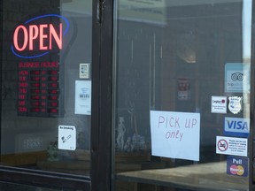 A restaurant on Victoria Avenue remains open for take out orders only in Regina on Monday, March 23, 2020.