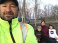 From left to right, Barry, Jodi, Donna and Bethany Carriere watch ice break-up in Cumberland House on April 29th. Barry Carriere, the acting vice president of the Northern Trappers Association, says the pandemic has provided an opportunity to pass on traditions to his children. Photo submitted by Barry Carriere.