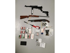 Saskatoon city police seized this cache of weapons on May 11, including a cattle prod, a rifle, a sawed-off shotgun, a handgun, an imitation firearm and more than 450 rounds of ammunition. Police also seized hydromorphone, fentanyl, methamphetamine, crack cocaine and Xanax. Photo from the Saskatoon Police Service Facebook page.