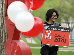 Bedford Road Collegiate Grade 12 students on May 20, 2020 picked up Class of 2020 signs made by Kota Graphics to display on their lawns — one way Saskatoon Public Schools is celebrating the high school seniors' graduation amid COVID-19 physical distancing requirements. (Michelle Berg / Saskatoon StarPhoenix)