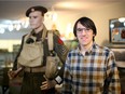 Michael Long, creator of a strategy game set during the Second World War called Radio General, stands next to a WWII soldier at the Saskatoon museum of military artifacts on May 28, 2020.