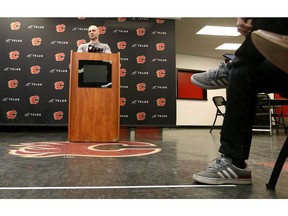 Flames Mark Giordano talks to media behind a line of tape about six feet from an interview podium after Calgary Flames practice in Calgary on Tuesday, March 10, 2020. Jim Wells/Postmedia