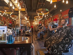 Regina's Bluecore Barber Company deals with a morning rush after opening back up for business Tuesday, May 19, 2020. Saskatchewan residents can walk around malls, get a haircut and go for a massage today for the first time since the province clamped down on consumer activities to slow the spread of COVID-19.