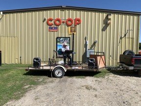 Elmer Lamadee strums his guitar outside the Paddock Wood Co-op on June 12, when he toured the community to lift neighbours' spirits. Photo supplied by Quinn Guedo on June 19, 2020. (Saskatoon StarPhoenix).