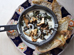 Columnist Jenn Sharp's favourite dish at Saskatoon's Hearth restaurant: a mix of wild and cultivated mushrooms with gooey cheese and sprigs of reindeer moss. Hearth was recently named one of Canada's 100 Best Restaurants 2020.