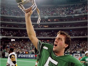 Saskatchewan Roughriders quarterback Kent Austin celebrates the 1989 Grey Cup win over the Hamilton Tiger Cats. Mike Cassese/Toronto Sun/QMI Agency ORG XMIT: POS1610211105130574