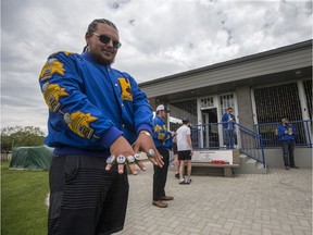 Saskatoon Hilltops offensive lineman Ryder Klisowsky adds another championship ring to his collection during a championship ring celebration to distribute 2019 Canadian Bowl championship rings at the teams practice field in Saskatoon on Saturday, May 30, 2020.