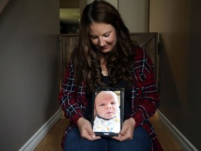Jasmine Akre holds up a photo of Joseph Michael Akre, to whom she was a surrogate mother. Joseph's parents, who live in Australia, were able to fly to Saskatoon in time for his birth, despite restrictions put in place because of the COVID-19 pandemic.