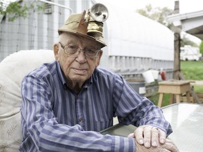 Former coal miner Harold Siggelkow shows off the carbide lamp and canvas hat he wore while mining underground in the 1940s in a coal mine in Coronach, Sask. on June 4, 2020. Evan Radford/Regina Leader-Post