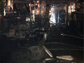 Firefighters say an open-air fire pit was the cause of a fire that completely destroyed a Pacific Heights house and garage. Photo supplied by the Saskatoon Fire Department.