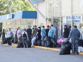 People lined up early with cans and bottles to recycle them at SARCAN, which opened on June 15, 2020 after a three-month shutdown due to COVID-19.