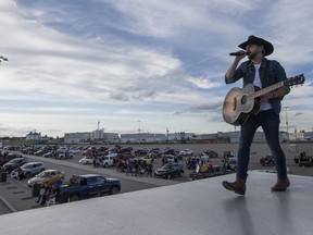 Canadian country musician Brett Kissel performs on the top of a semi trailer at the SaskTel Centre parking lot in Saskatoon on June 27, 2020.