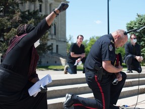 REGINA, SASK : June 5, 2020 -- Regina Police Chief Evan Bray kneelss during a Black Lives Matter rally that went from the Royal Saskatchewan Museum to the Saskatchewan legislative Building in Regina, Saskatchewan on June 5, 2020. BRANDON HARDER/ Regina Leader-Post