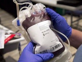 As the COVID-19 pandemic continues to make people sick across Canada, health authorities are imploring Canadians to donate blood -- all Canadians except men who have had recent sex with other men, despite a 2015 Liberal pledge to end this ban. A bag of blood is shown at a clinic in Montreal, Thursday, November 29, 2012.