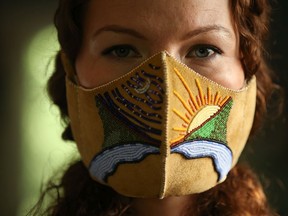 Vanessa Hyggen is a Cree artist creating beadwork masks to reflect on Treaty Six history and health in the time of COVID-19. Photo taken in Saskatoon, SK on Thursday, June 25, 2020. (Michelle Berg/Saskatoon StarPhoenix.)