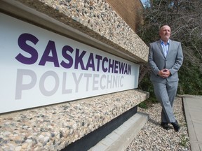 Mike Gillespie, associate vice-president of learning and teaching and the interim associate vice-president of student services at Saskatchewan Polytechnic, stands in front of the school's Regina Campus on July 29, 2020.