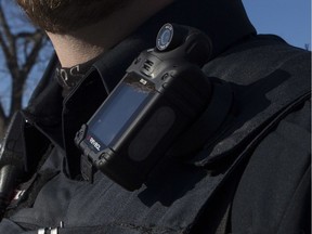 A Toronto Police Officer poses for a photo wearing a body camera as part of his equipment while on duty in Toronto on November 25, 2015.