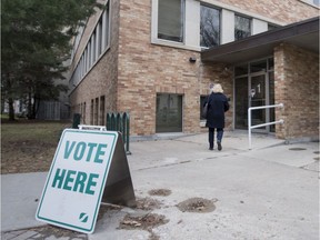 People walk in to Saskatoon City Hall to cast their votes in the advanced polls in Saskatoon, SK on Saturday, Oct. 15, 2016.