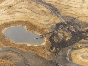 A trench cuts into a wetland in order to drain it, and prepare it for cultivation, in Quill Lakes in October 2017. The dark areas used to be wetlands.