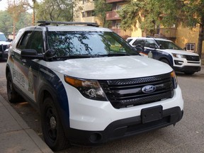 Saskatoon police have charged a 20-year-old man and a 17-year-old girl after an officer allegedly had a gun pointed at them while responding to a report of a break-and-enter on Aug. 8, 2020.