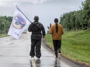 Christopher Merasty, left, and Tristen Durocher during their walk from Air Ronge to Regina. Photo by Kandis Riese.