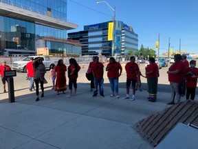 People gather outside Saskatoon provincial court on July 21, 2020 for the video appearance of Ivan Roberto Martell, the man charged with second-degree murder in the death of 28-year-old Ally Moosehunter (Witchekan), who was found dead in a Hampton Village neighbourhood home on March 4, 2020.