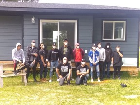 Waterhen First Nation high school students completed a home this June that will add space to their school facilities. From left to right, the students are Emerson Vincent, Darren Runningaround, Rory Lasas, Christian Ernest, Carson Fiddler, Drayden Lapratt, Hayden Lapratt, TJ Bernard, Sanjay Ernest, and Skye Ernest. Photo supplied by Judy Fiddler on July 2, 2020. (Saskatoon StarPhoenix.)