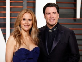 Actress Kelly Preston and husband, actor John Travolta, arrive at the 2015 Vanity Fair Oscar Party in Beverly Hills, California February 22, 2015.