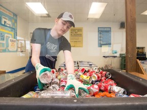 SARCAN worker Donovan Dixon sorts containers at the East Victoria Avenue location in Regina on July 20, 2020.