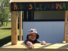 Six-year-old Henry Lucas runs a lemonade stand and fundraiser in Watson, Sask. on Saturday, Aug. 1. (submitted photo)