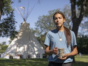 Tristen Durocher, who has set up a camp in front of the Legislative Building to draw attention to the suicide crisis among Indigenous people in Saskatchewan and call on the government to act, stands for a portrait outside his camp in Regina, Friday, August, 14, 2020.