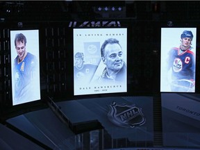 A moment of silence is held for the late Dale Hawerchuk, a Winnipeg Jets legend, before Tuesday's NHL playoff game between the Montreal Canadiens and Philadelphia Flyers in Toronto.