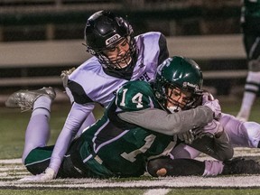 The Holy Cross Crusaders and the Saint Joseph Guardians battle it out in the city 6A high school football final at SMF Field on November 1, 2019 in Saskatoon.