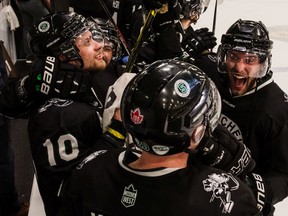 The bench celebration begins as the U of S Huskies men's hockey team captures a Canada West conference title over the UBC Thunderbirds at Merlis Belsher Arena on the U of S Campus on Saturday, February 29, 2020 in Saskatoon.