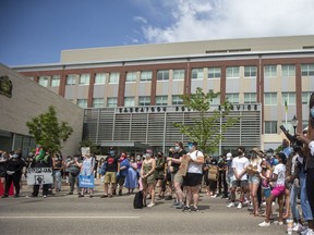 Marchers in support of Black Lives Matter gather outside of the Saskatoon Police headquarters in Saskatoon, SK on Saturday, June 13, 2020.