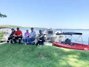 The Hutterian Emergency Aquatic Response Team (HEART) is pictured at Makwa Lake near Makwa Sahgaiehcan First Nation where they recovered the body of a six-year-old boy who drowned. They were joined by Sandy and Gene Ralston of Boise, Idaho. From left are Tyler Maendel, Paul Maendel, Sandy Ralston, Gene Ralston and Manuel Maendel. Photo by Becky Zimmer, Local Journalism Initiative reporter for the Battlefords Regional News-Optimist