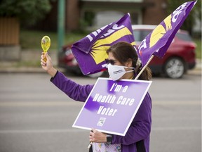 An SEIU-West member protests in 2020. The union is one of four denouncing the Saskatchewan government's choice of using an emergency order to forcibly redeploy thousands of staff.